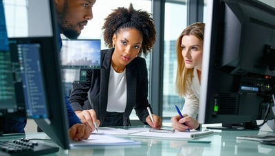 Business professionals collaborating on software solutions